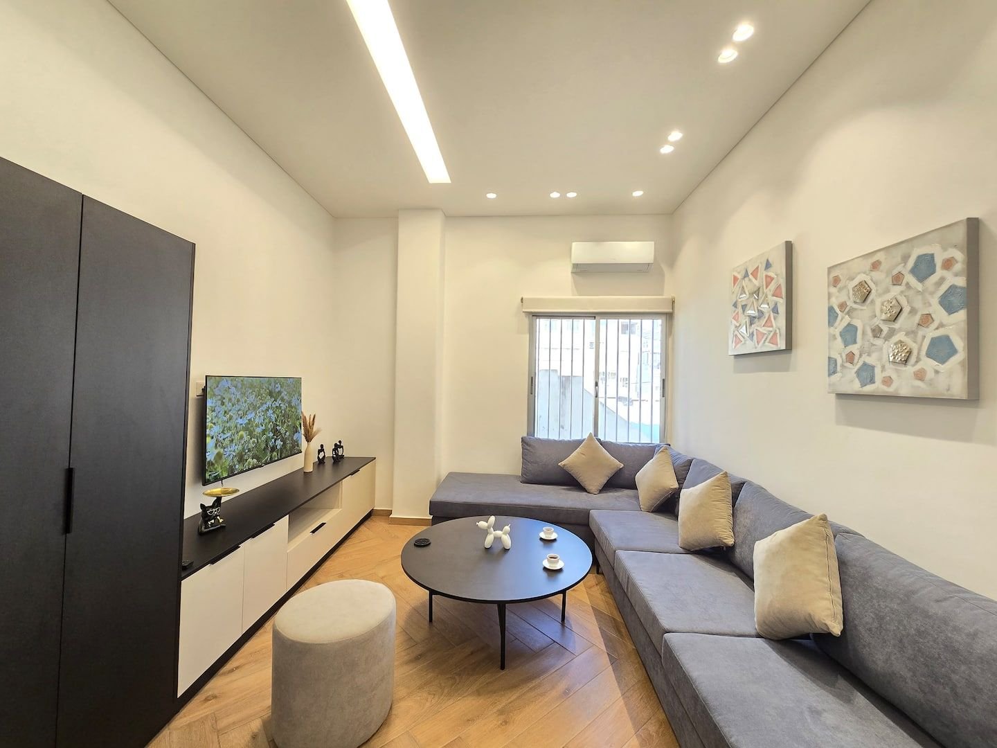 Renovated living room with corner sofa, Spacious 1-Bedroom in Geitawi, Achrafieh