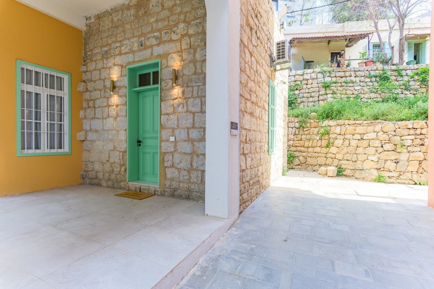 Courtyard with the green front door, Heritage Loft 2-Bedroom in Achrafieh