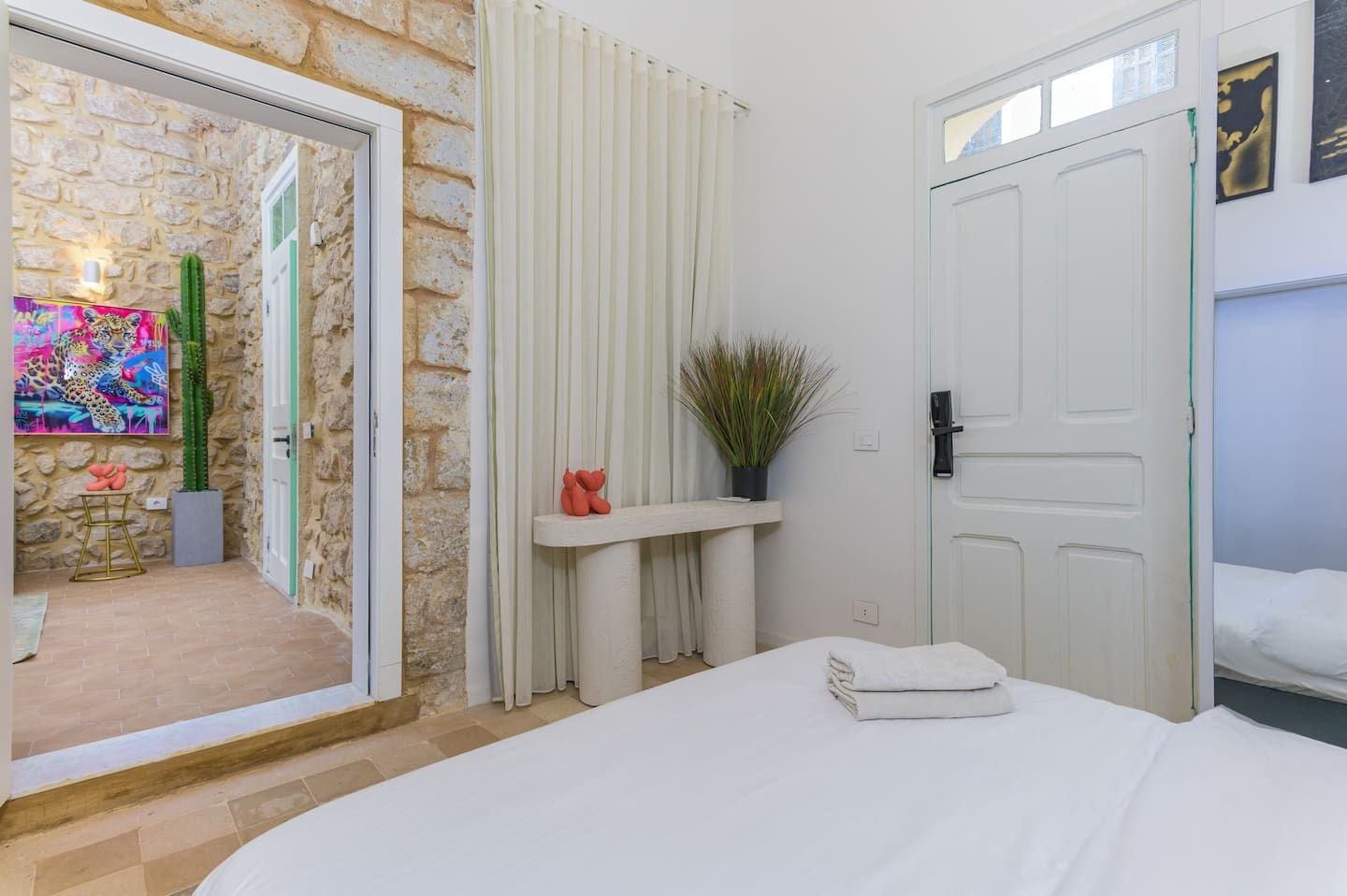 Bedroom with mirror and bench, Heritage Loft 2-Bedroom in Achrafieh