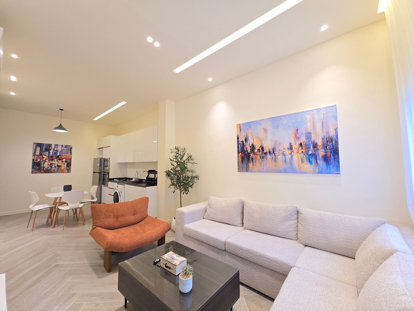 Living room with sofa and dining area, Modern Achrafieh 1-Bedroom with 24/7 Power