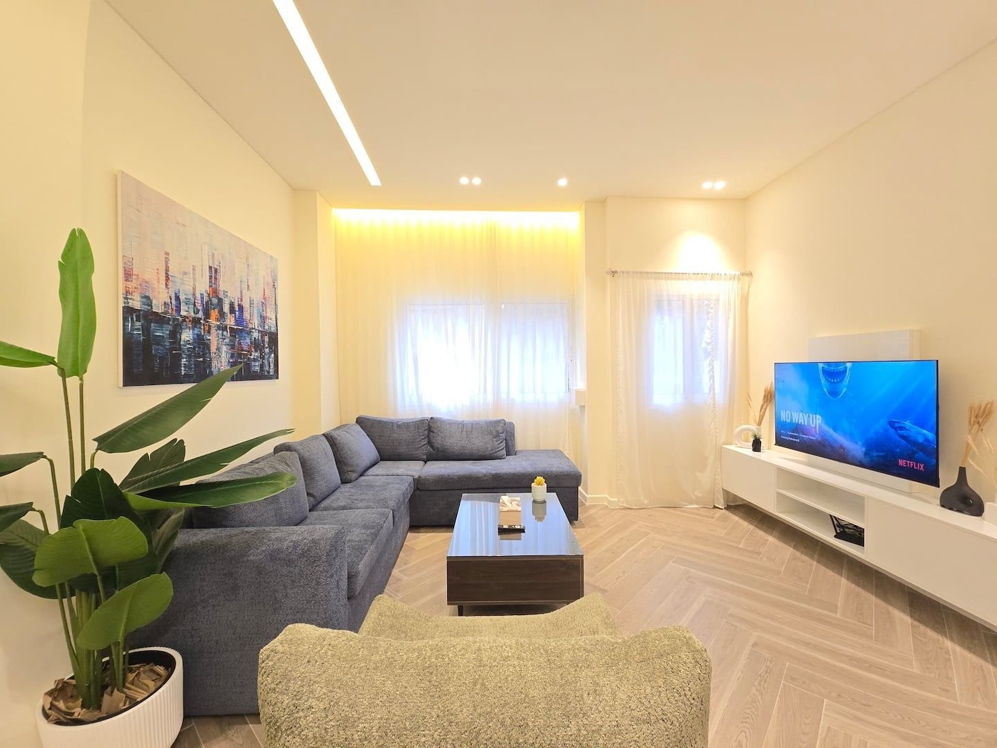 Living room with corner sofa and smart TV, Sioufi 1-Bedroom with 2 Bathrooms