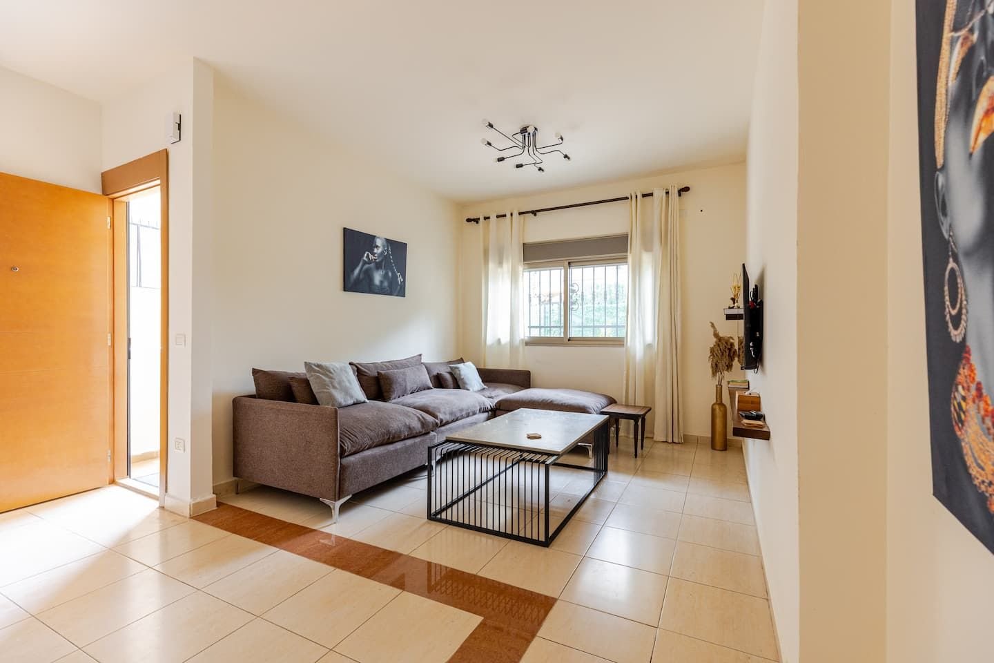 Living room and entrance, Modern 1-Bedroom with Private Entrance & Terrace