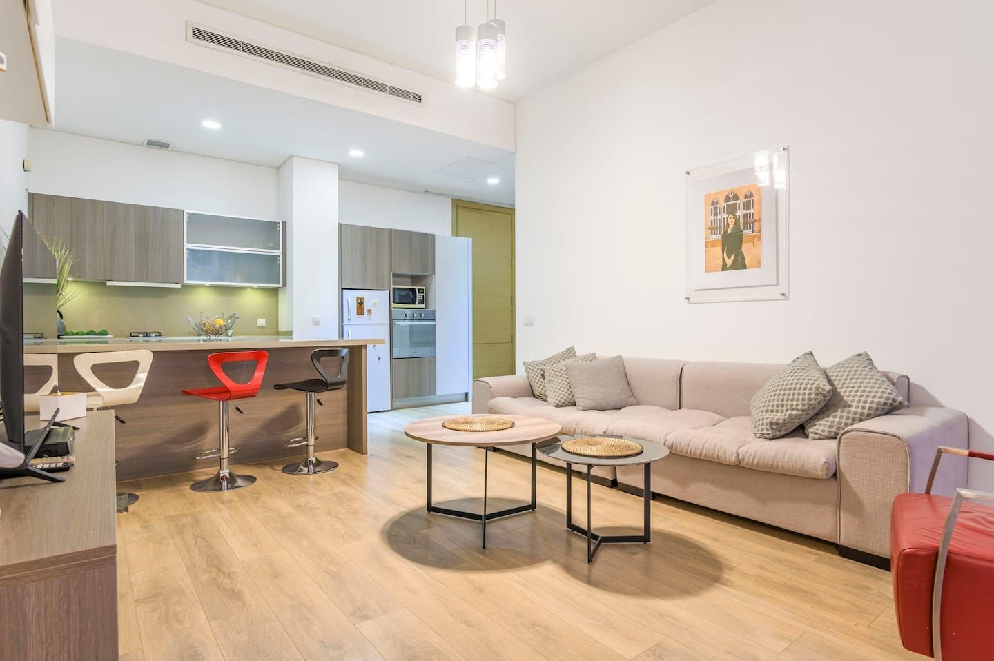 Open-plan living room and kitchen, Comfy 1-Bedroom with Indoor Pool & Gym