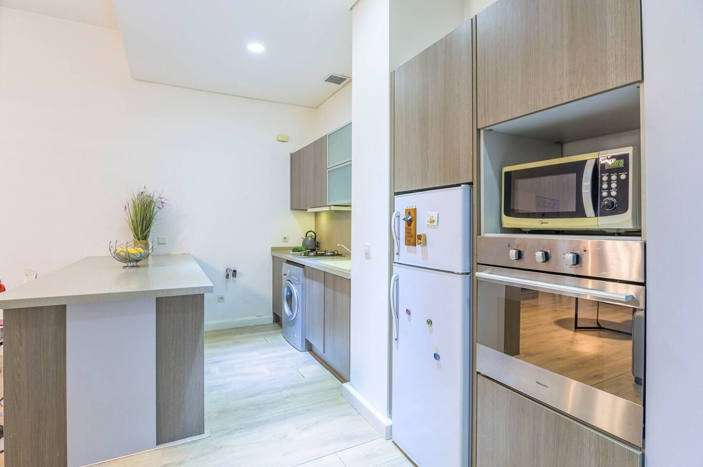 Kitchen with oven and microwave, Comfy 1-Bedroom with Indoor Pool & Gym