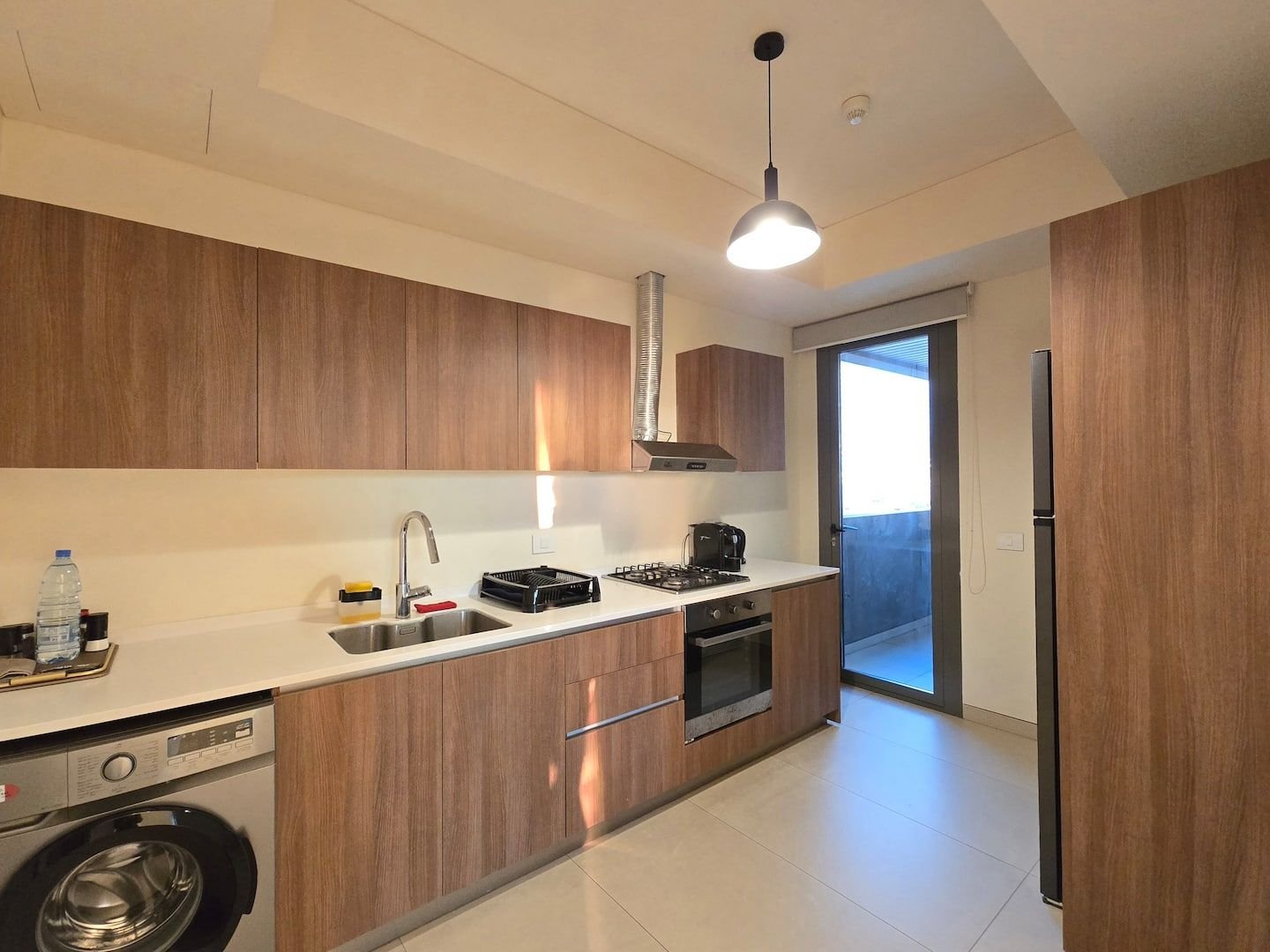 Kitchen with washing machine, City Skyline 3-Bedroom with Pool, Gym & Playground