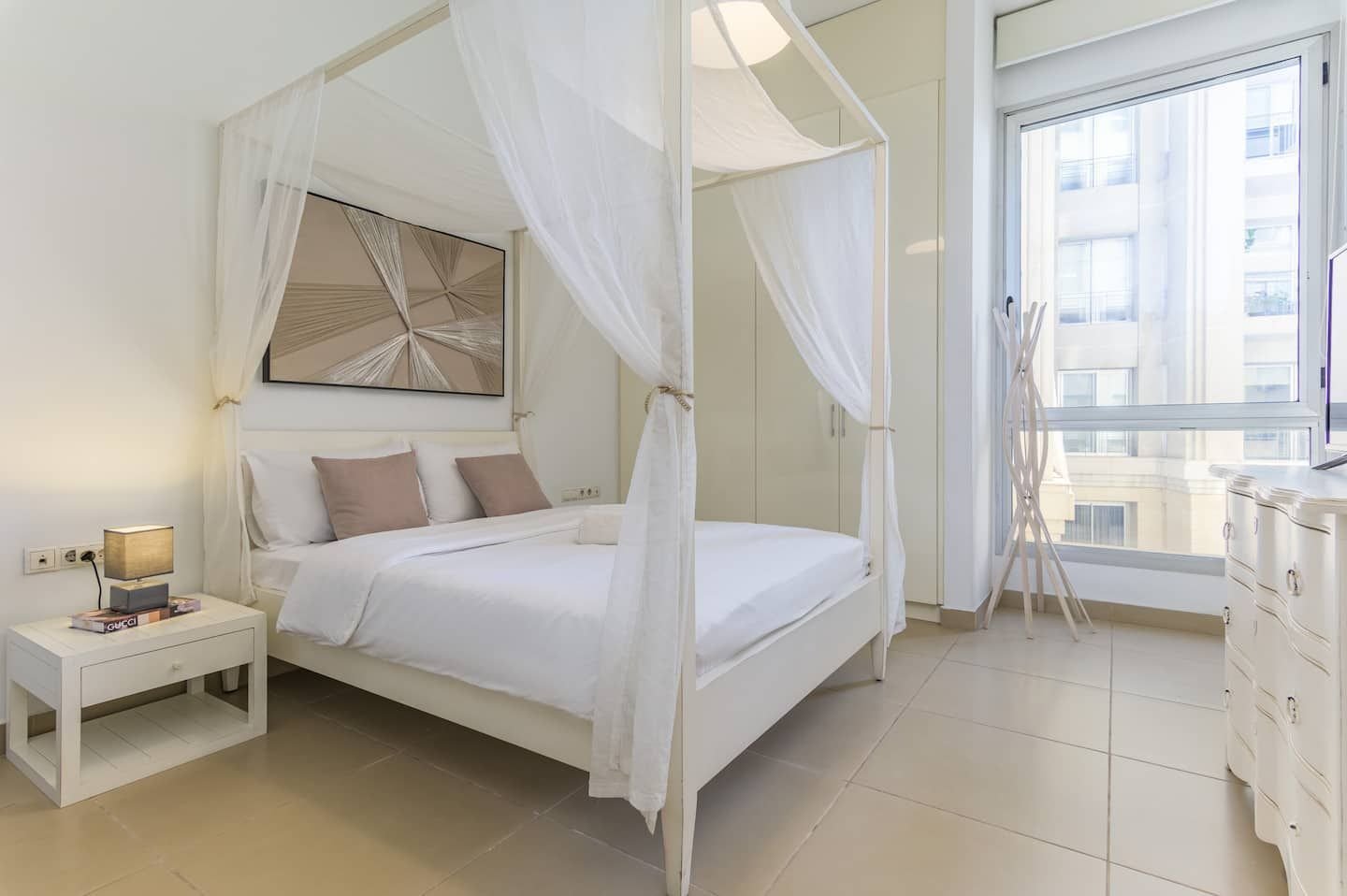 Bedroom with four-poster canopy bed, Downtown Saifi 1-Bedroom with Pool & Bathtub