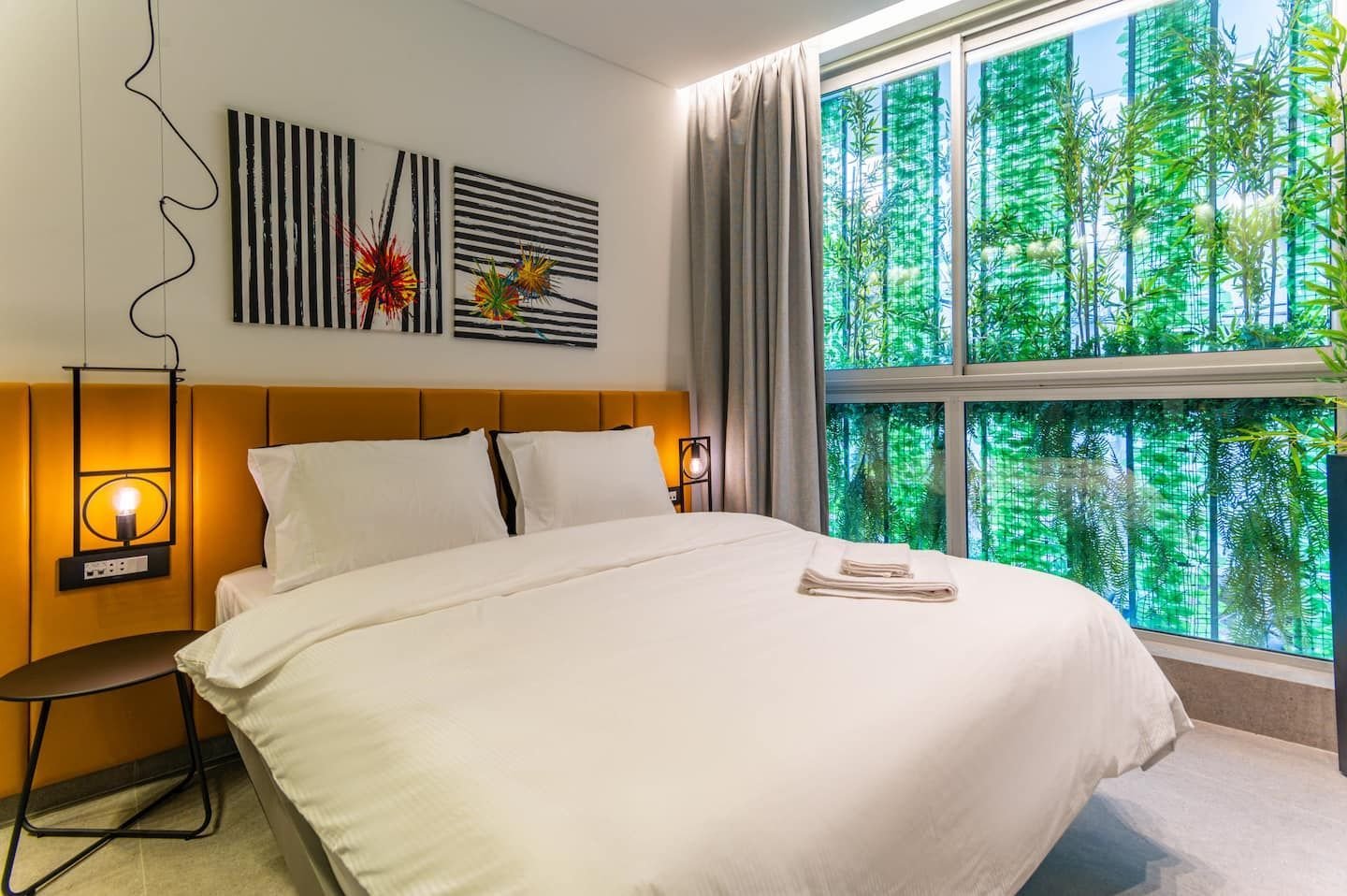 Bedroom overlooking a vertical garden, The Atelier at Retro 67