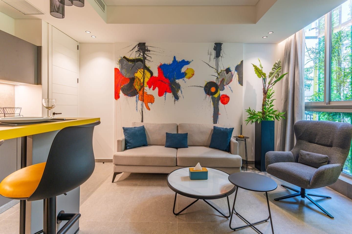 Lounge with colourful mural, The Atelier at Retro 67