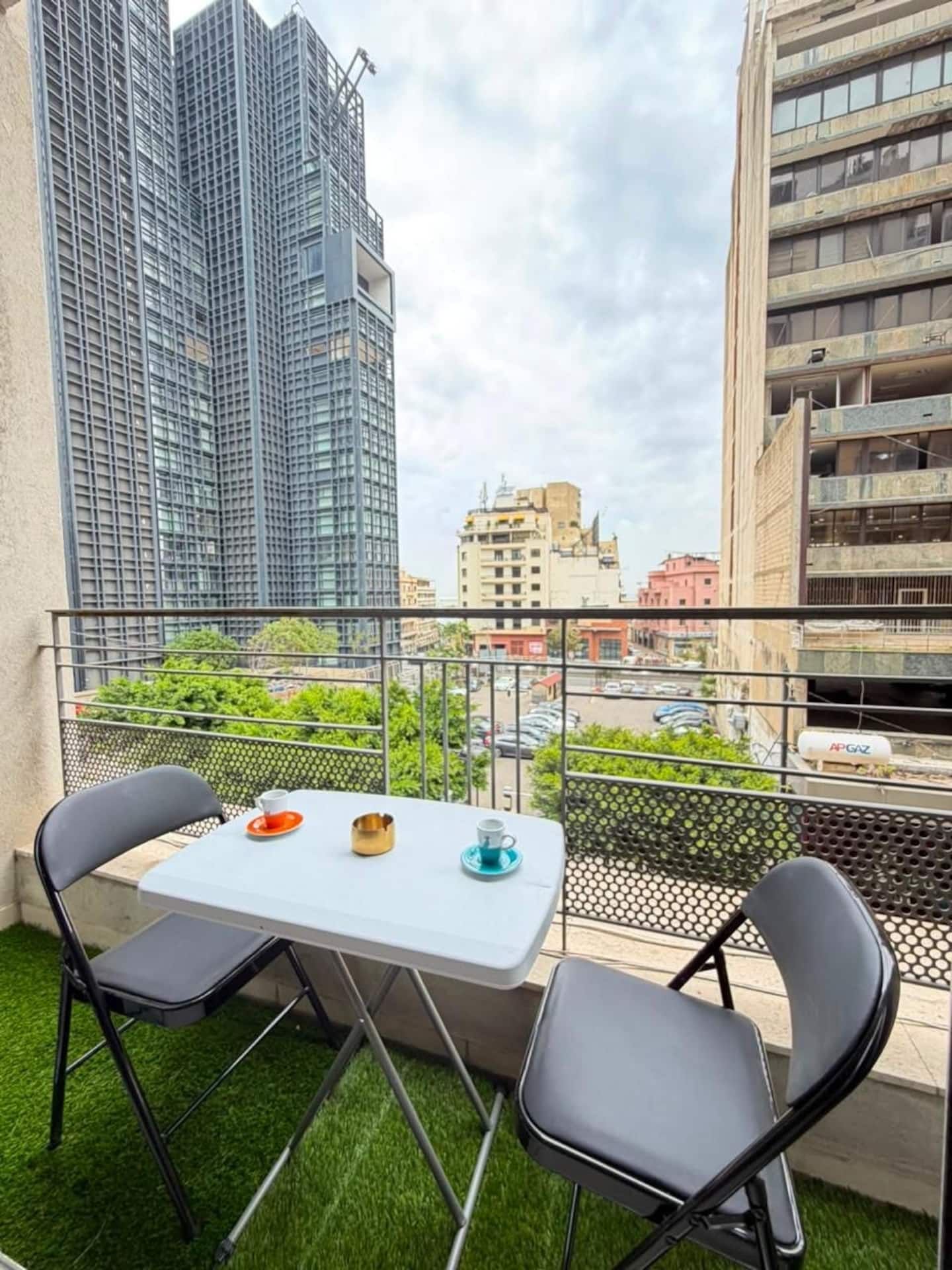 Balcony with bistro table, Saifi 1-Bedroom with Balcony & Heated Indoor Pool