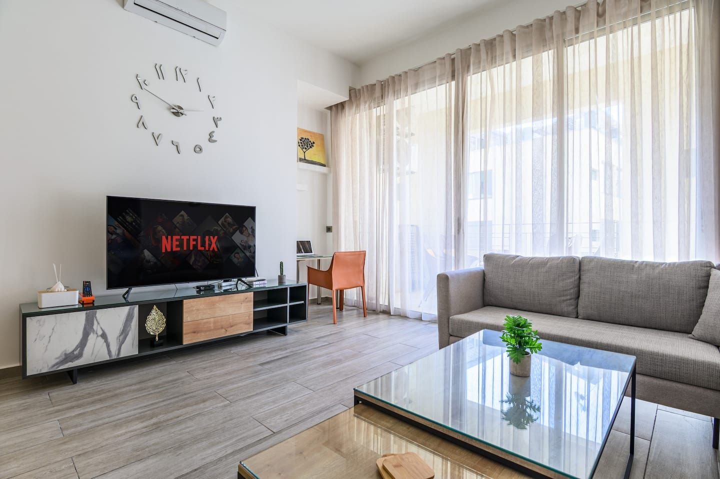Bright living room with smart TV, Saifi 1-Bedroom with King Bed, Pool & Gym