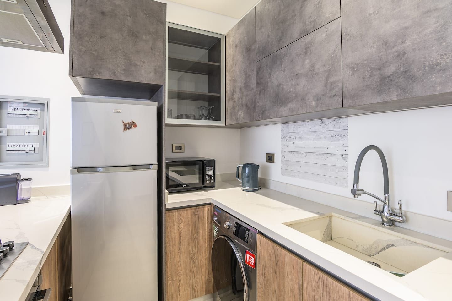 Kitchen with fridge and washing machine, Saifi 1-Bedroom with King Bed, Pool & Gym