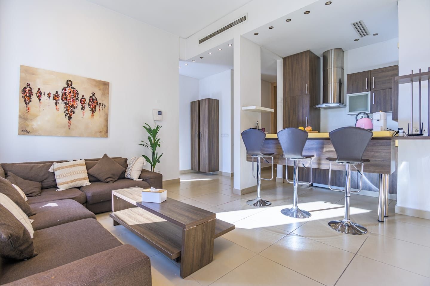 Open-plan living room and kitchen, Modern Saifi 1-Bedroom with Heated Pool