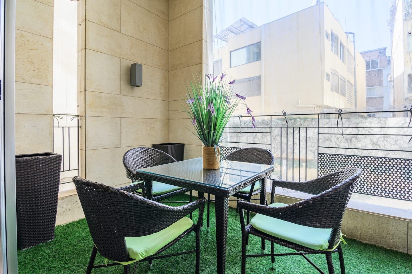 Balcony with outdoor dining set, Central 1-Bedroom with Pool & Gym