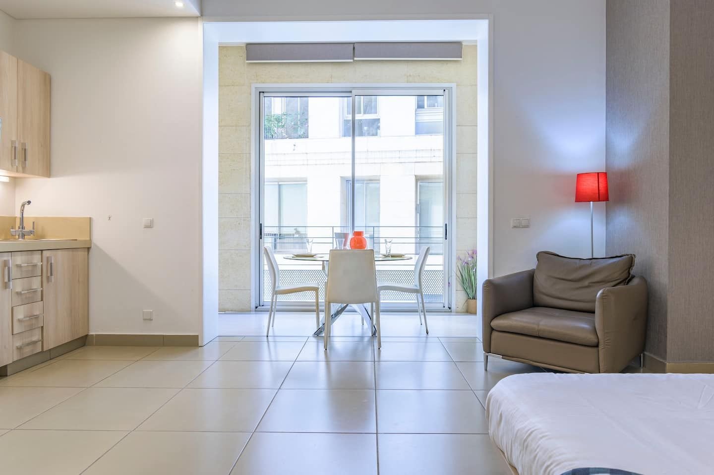 Lounge by the balcony doors, Central Saifi Studio with Pool & Gym