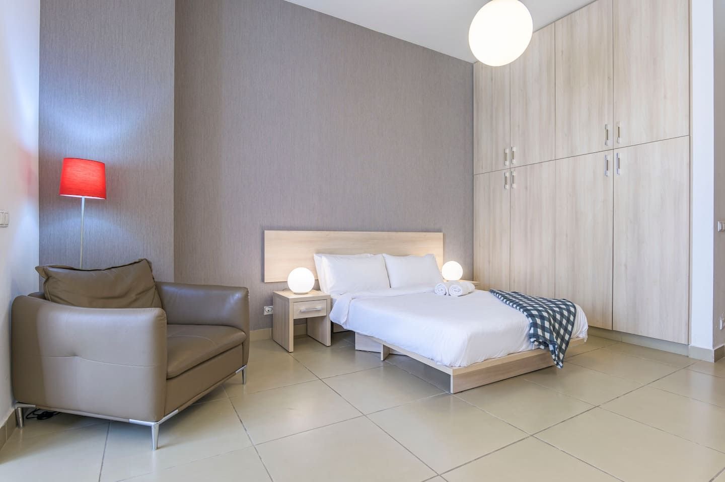 Bed and armchair, Central Saifi Studio with Pool & Gym