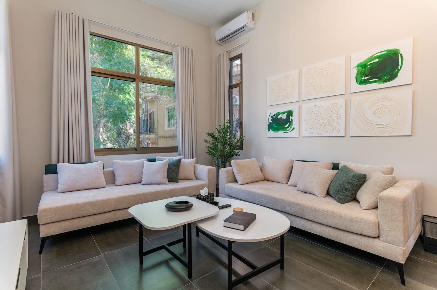 Living room with two sofas, Flat 3B (green interior) at Saifi 300, Tabaris