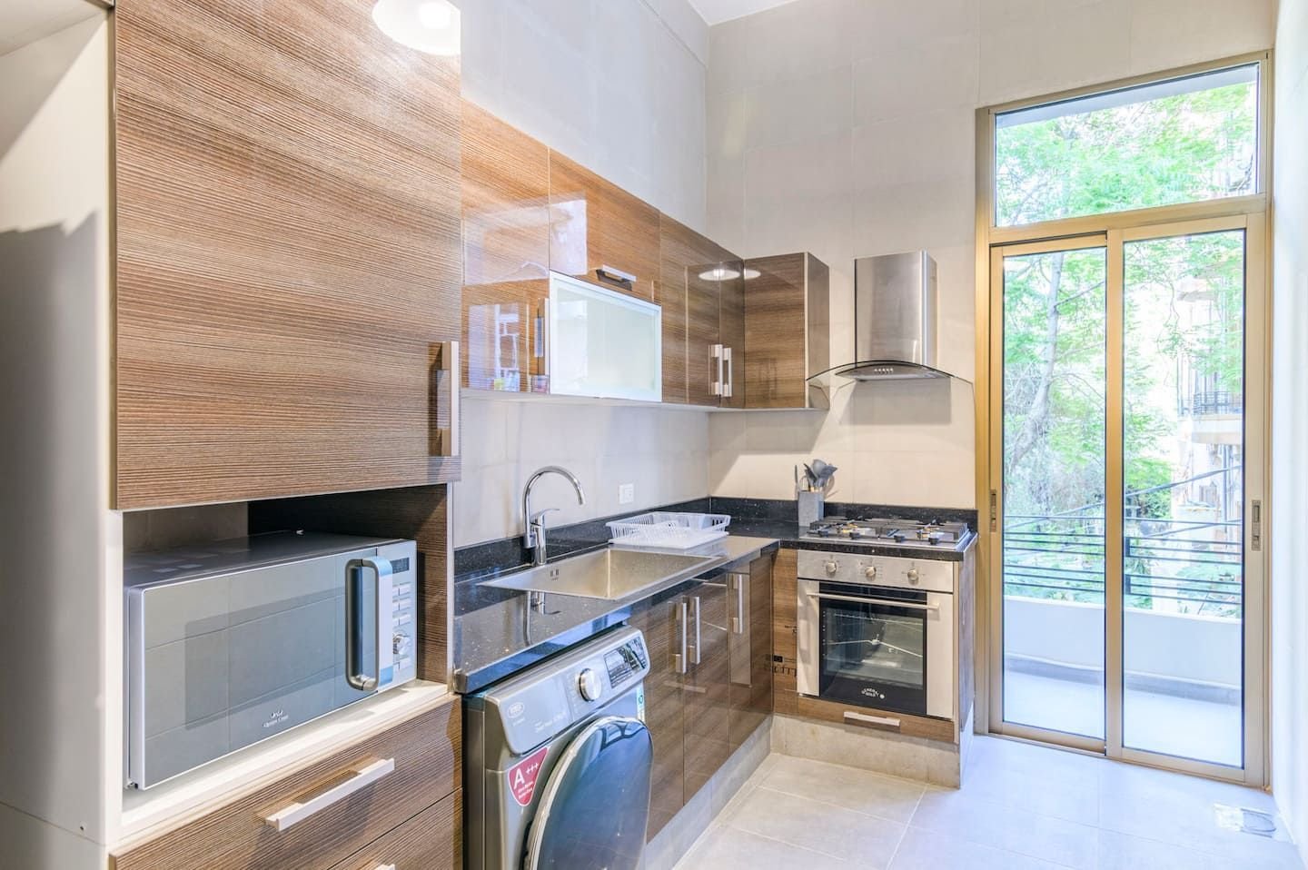 Kitchen with balcony access, Flat 3B (green interior) at Saifi 300, Tabaris