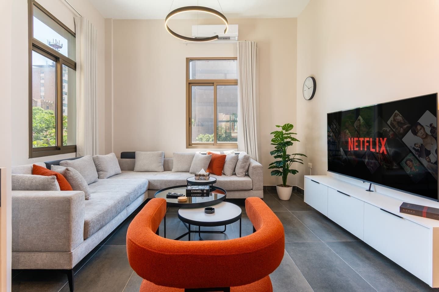 Living room with red armchair, Flat 1A (red interior) at Saifi 300, Tabaris