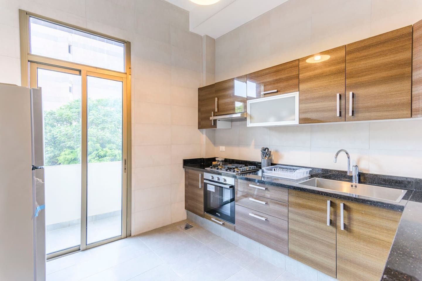 Kitchen opening onto the balcony, Flat 3A (red interior) at Saifi 300, Tabaris