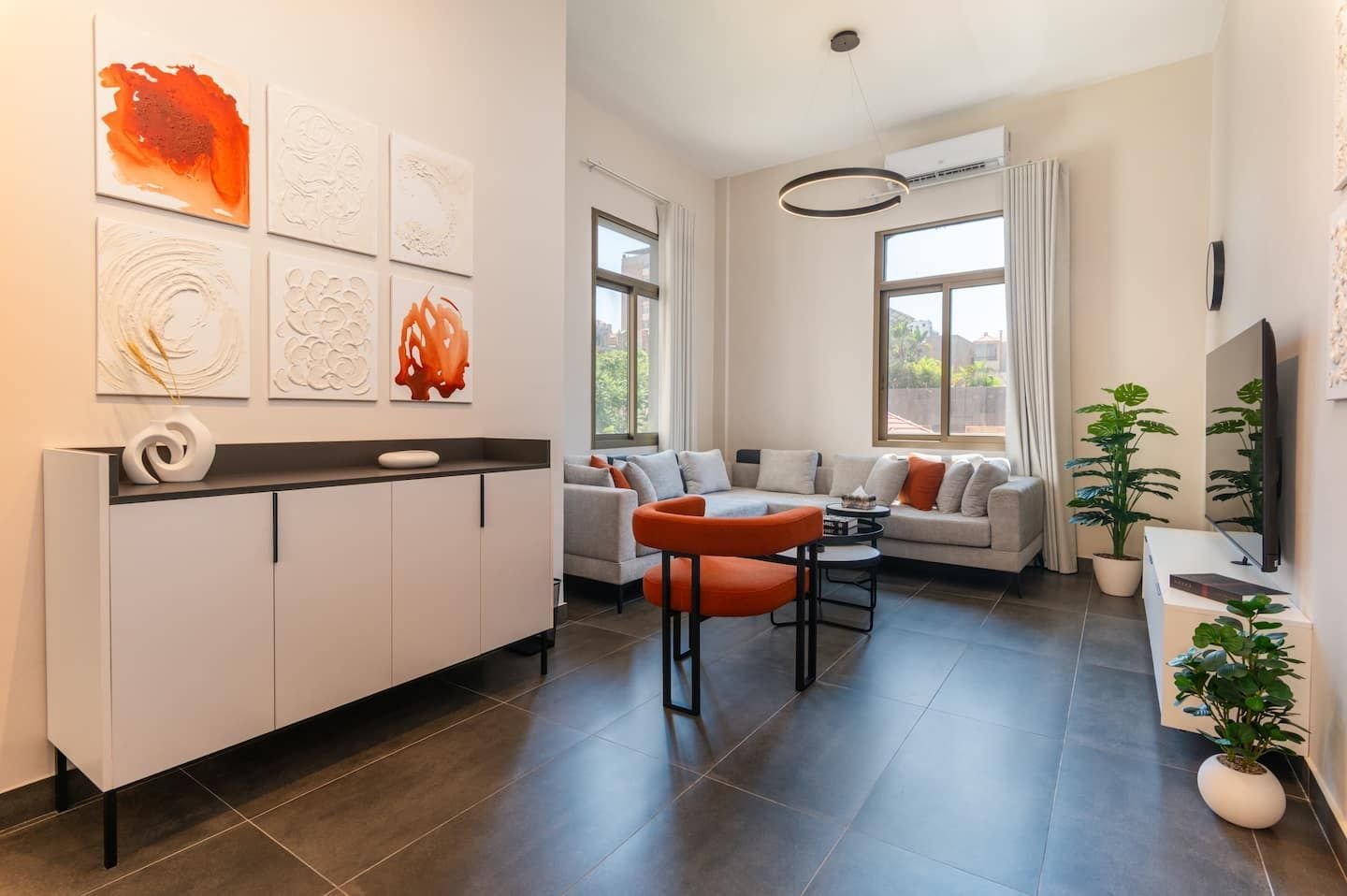 Living and dining area, Flat 2A (red interior) at Saifi 300, Tabaris
