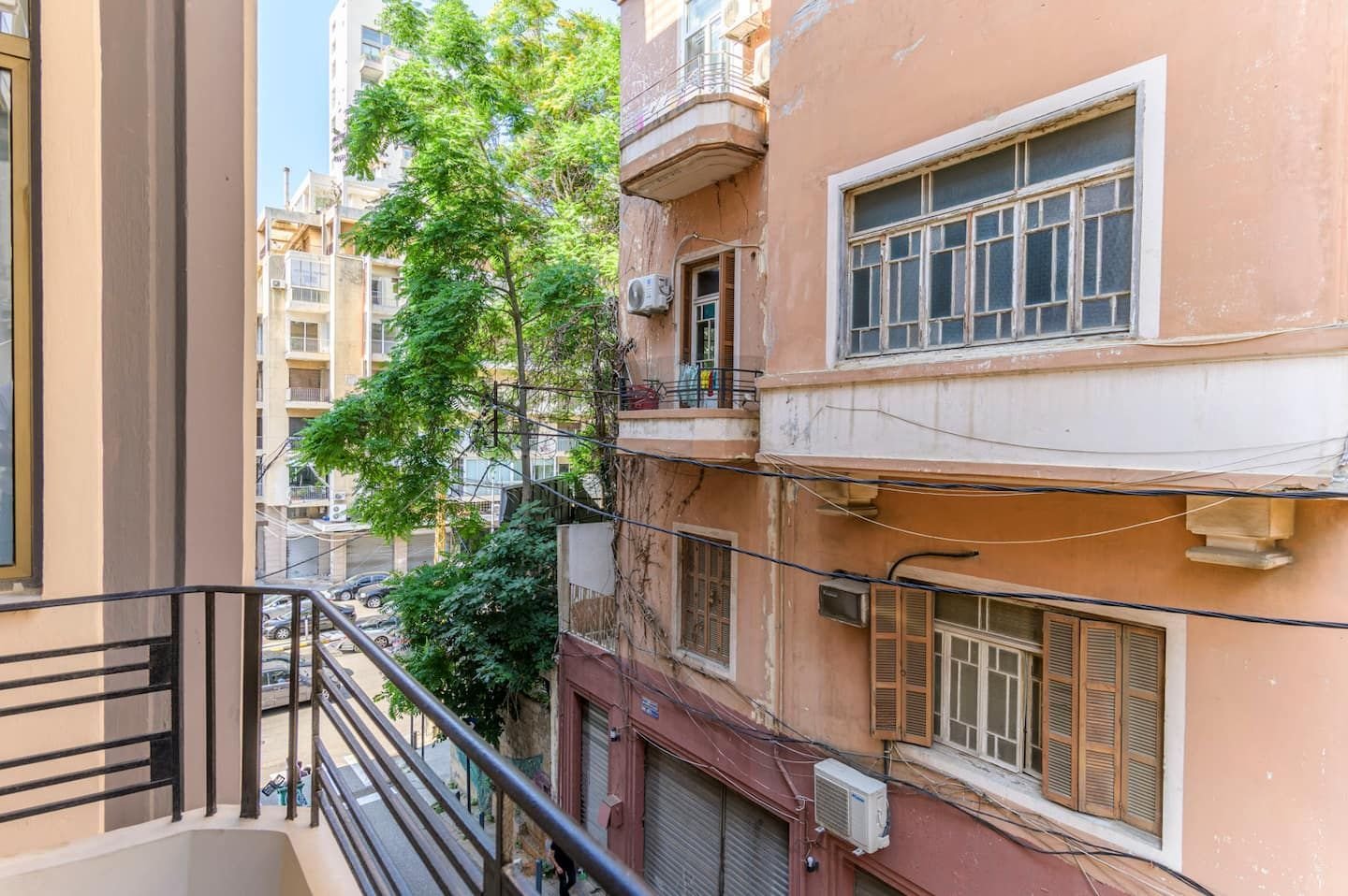 Balcony over a leafy street, Flat 2A (red interior) at Saifi 300, Tabaris